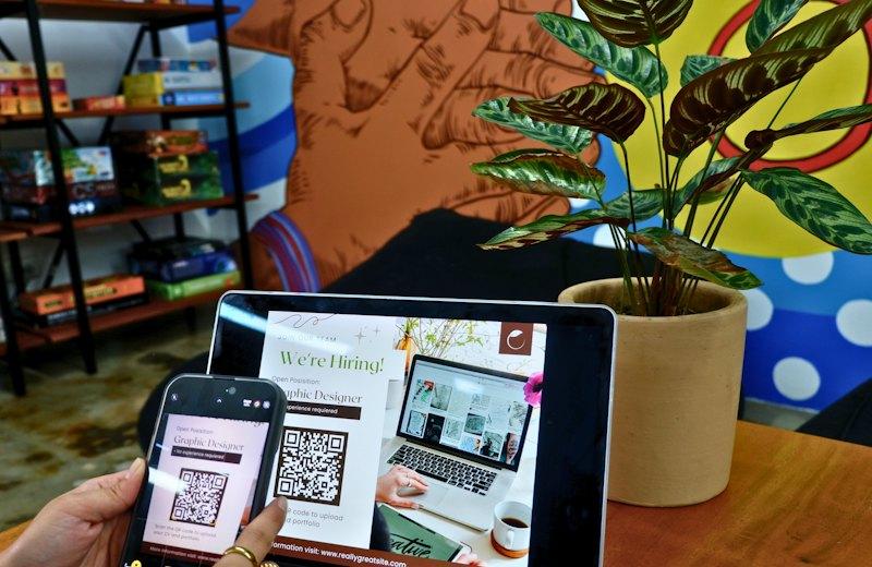 Laptop screen showing a QR code